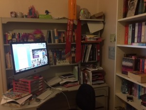 Desk, computer, and bookshelves of Rachael Johns