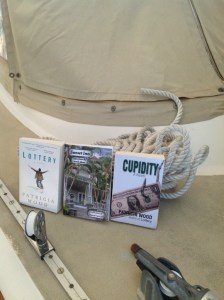 Patricia's books on the deck of sailboat Orion