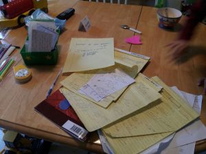 Table covered in paperwork, kids' breakfast etc.