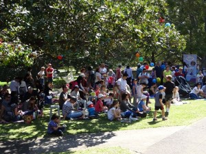 Audience enjoying the shade in front of the Main Stage